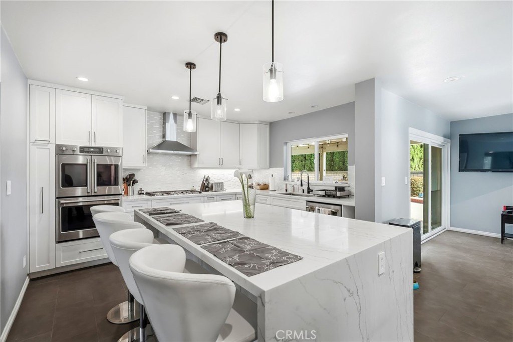 Modern kitchen with island and pendant lighting
